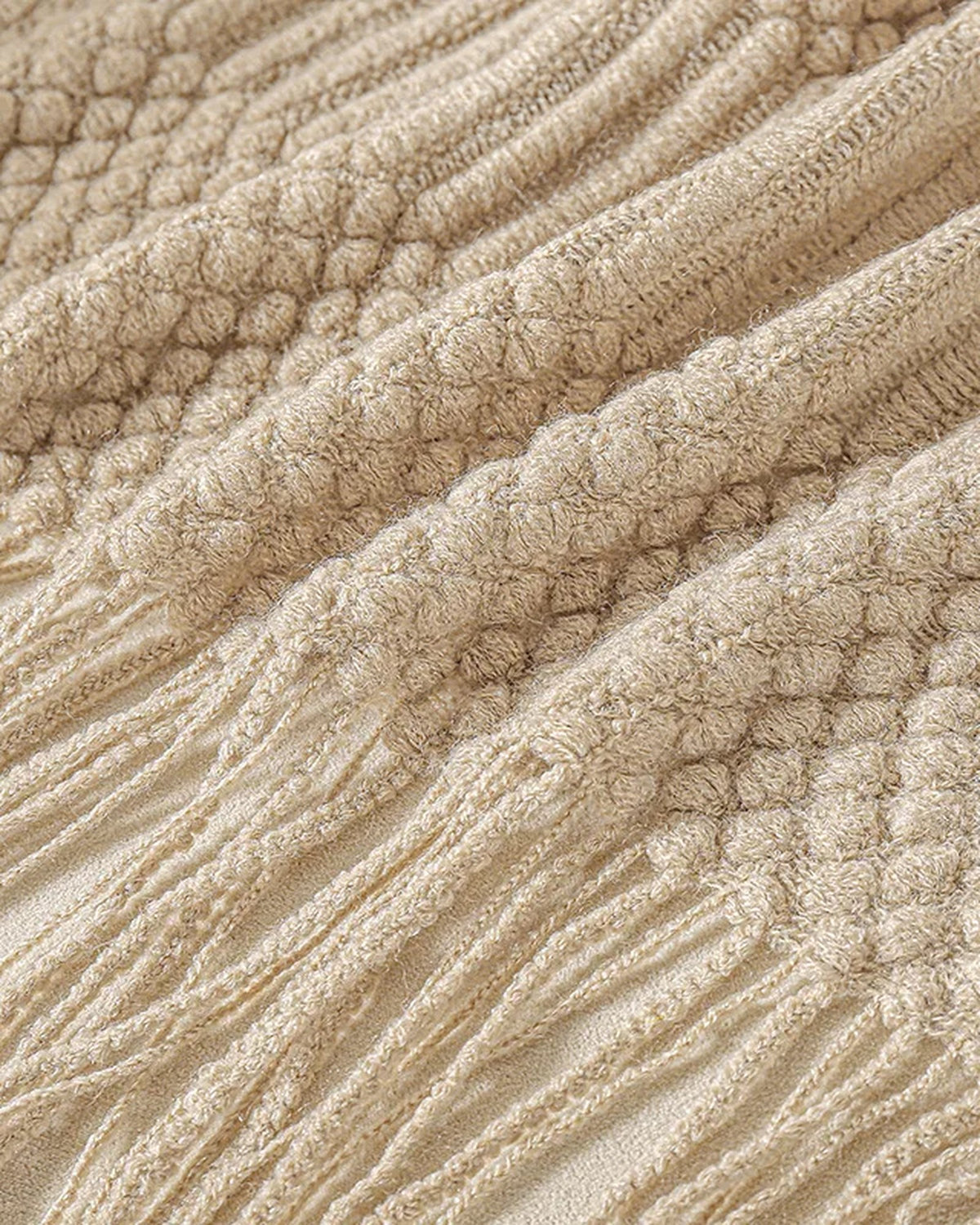Close-up of the knit and tassel fringe