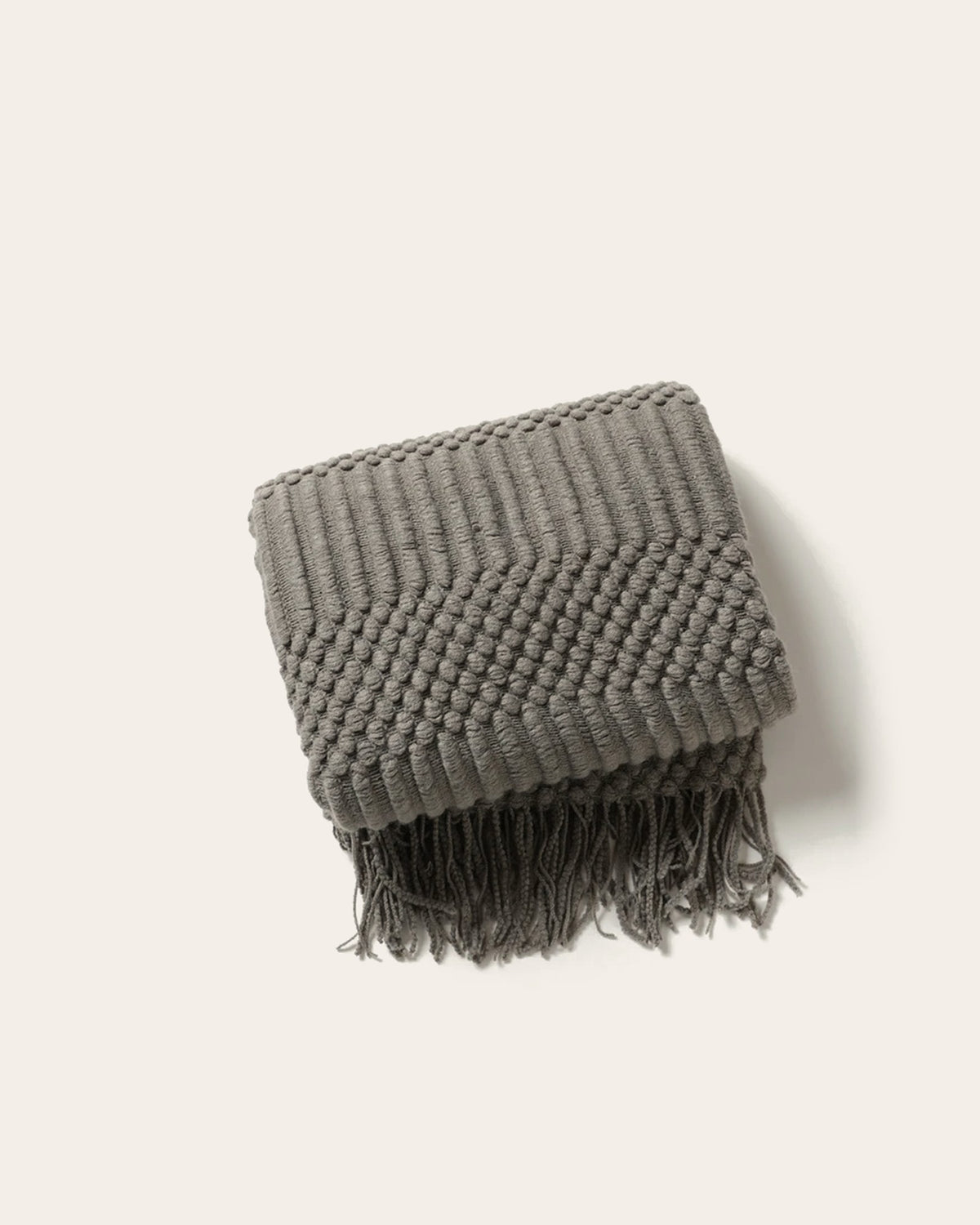The Elsie Knitted Throw in Charcoal, folded