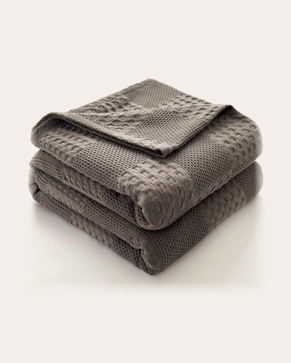 The Wren Cotton Waffle Throw in Charcoal, folded
