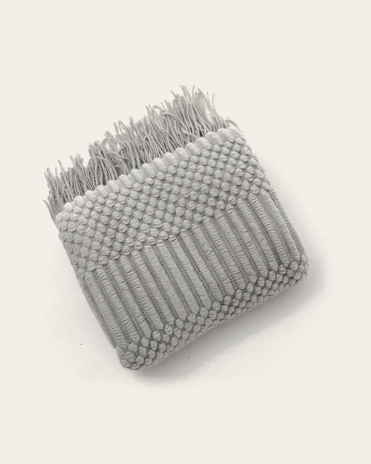 The Elsie Knitted Throw in Dove Grey, folded