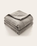 The Wren Cotton Waffle Throw in Dove Grey, folded