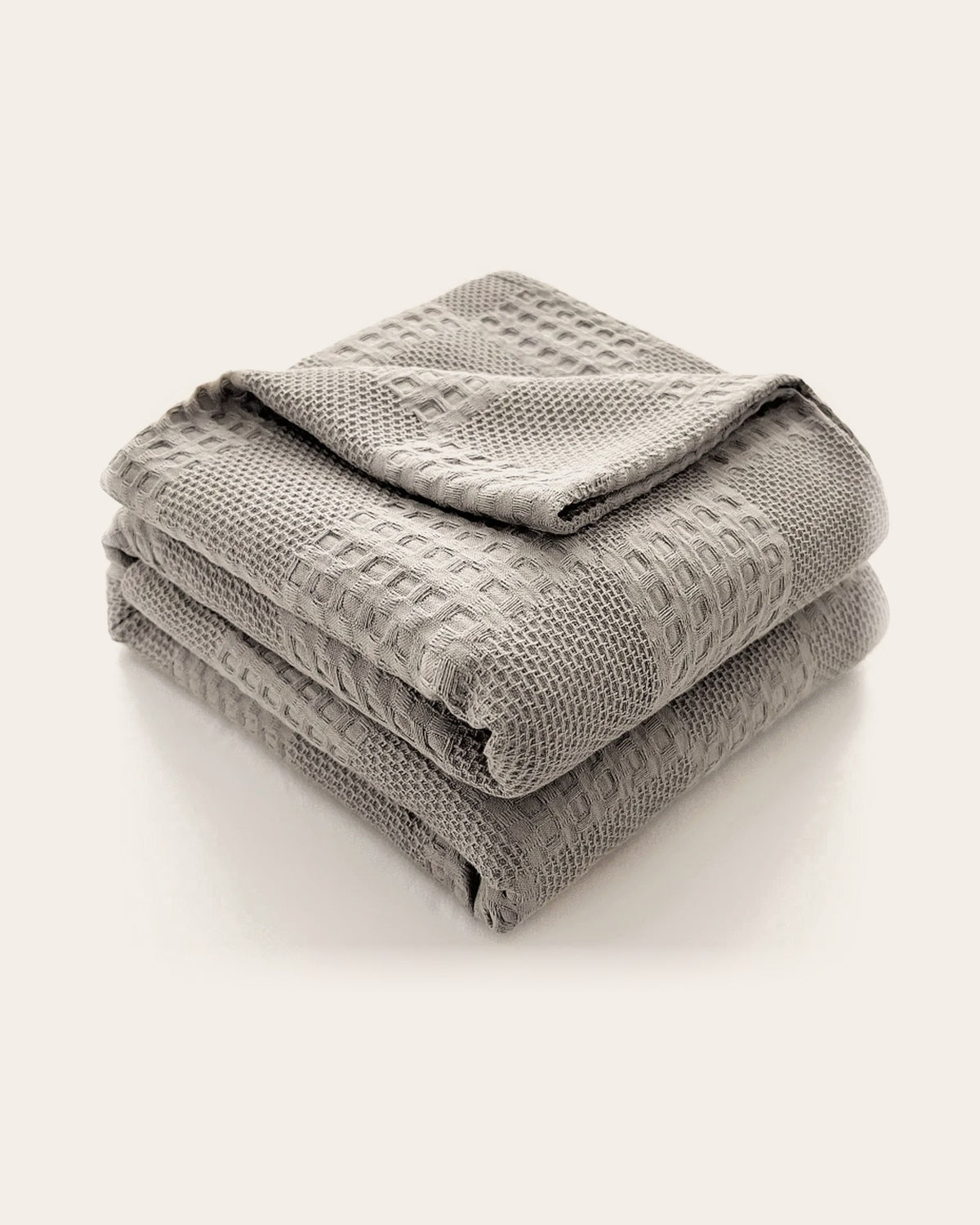 The Wren Cotton Waffle Throw in Dove Grey, folded